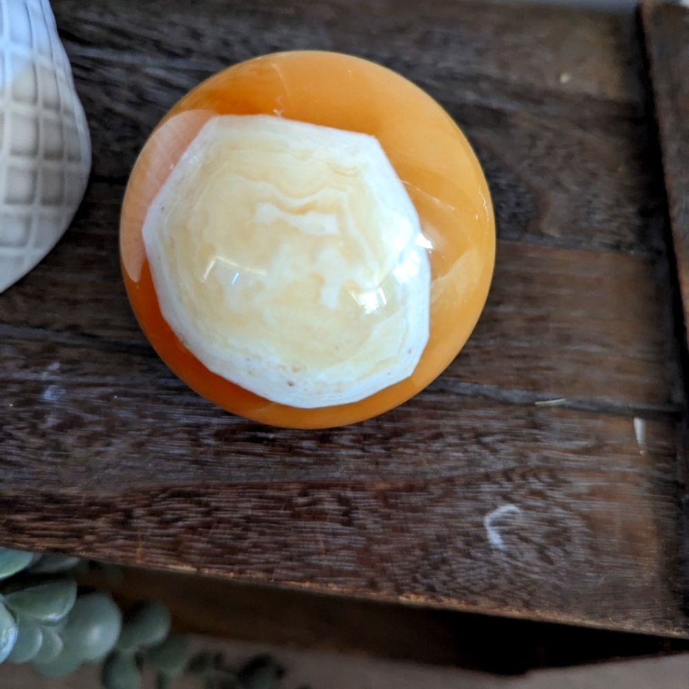 Honey calcite sphere with banding